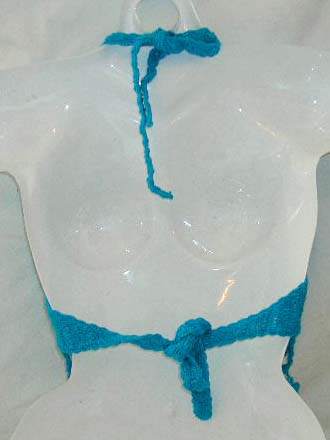 Seasonal clothing and accessory supplier distribute blue crochet top with dangle and top ties at neck and back design 
