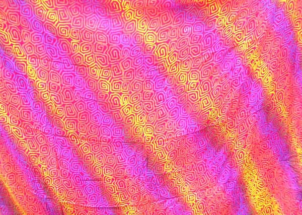 Trendy wholesale sarong online rainbow-yellow, orange, purple sarong wrap motif diagonal line and spiral pattern design        