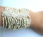Seashell white seed beaded bracelet forming in wide band design 