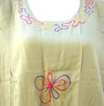 Medium weight rayon pull over lady hawaiian dress with embroidered flower on top and bottom and also below the knee length design