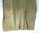 Medium weight rayon pull over lady hawaiian dress with embroidered flower on top and bottom and also below the knee length design