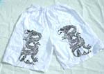 White kid pant with black dragon and string tie design on waist