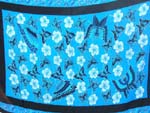 Rainbow-yellow, green, purple, blue sarong wrap motif diagonal line and spiral pattern design