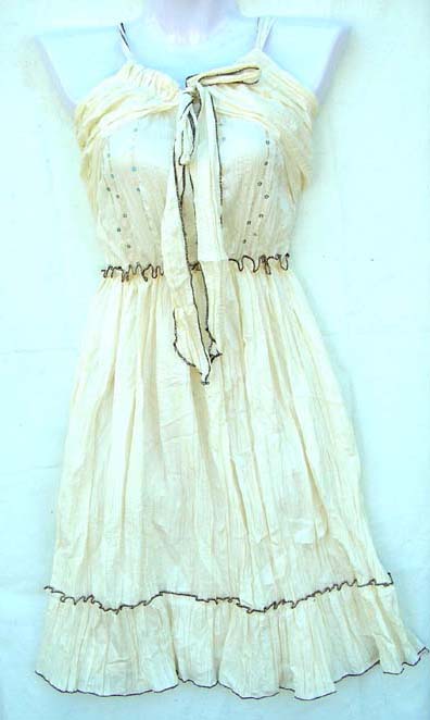 Summer wear fashon outlet sidtributing unique clthing at wholesale price. Cream colored summer dress with fitted top in V neck shape, beaded ribbing and cute bow between bust. 