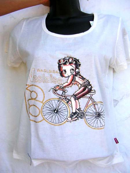 Teen fashion wear supplied at wholesale price from clothing manufacturer. Shirts for girls with flirty picture of girl on a bicycle      