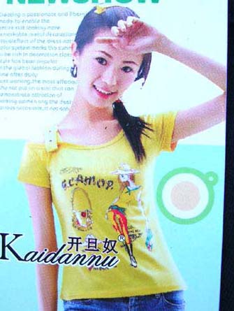 Teen fashion wear supplied at wholesale price from clothing manufacturer. Shirts for girls with flirty picture of girl on a bicycle      