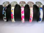 Assorted color cuff watch motif in variety oval shape design with printed flower pattern on bangle