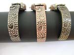 Dotted round clock face motif double heart on top and bottom and nugget with heart shape on bangle