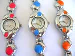 Double dolphin watch with round clock face and assorted color ball decor