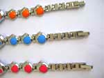 Double dolphin watch with round clock face and assorted color ball decor