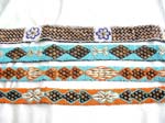 Assorted design seashell and coconut wooden button belt with two strings for closure
