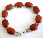 Oval shape gold sand stone bracelet with chain lock for closure 
