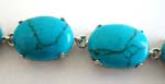 Turquoise fashion bracelet in oval shape with chain lock for closure 