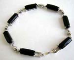 Blue sand stone fashion bracelet in long shape connected with silver heart design and chain lock for closure