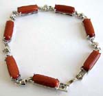 Gold sand stone fashion bracelet in long shape connected with silver heart design and chain lock for closure