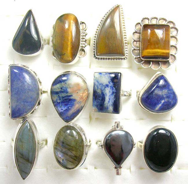 Costume designed 925. sterling silver rings with an assortment of precious onyx, tiger eye, jasper or serpentine gems