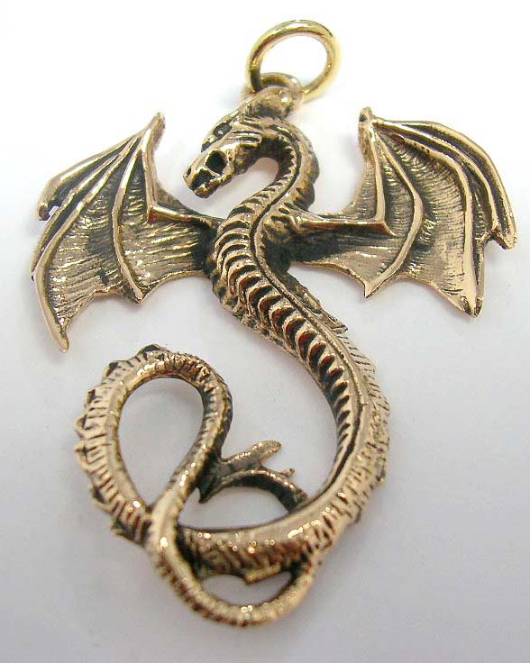 Wings expanded on flying dragon designed bronze pendant         