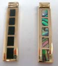Elongated rectangle shaped pendant with precious stones inlaid. Comes in an assortment of colors picked randomly by our warehouse staff 