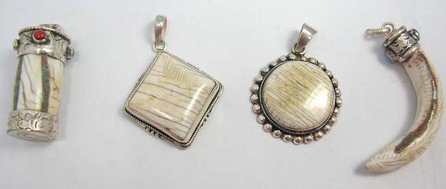 Ethnic jewelry wholesaler and supply animal's teeth set in 925. sterling silver pendant