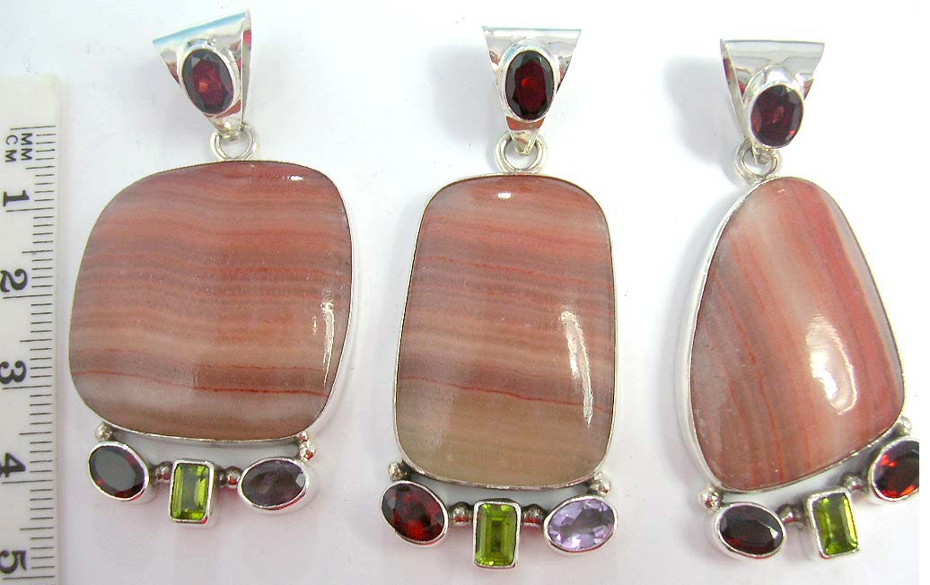 Antique designed pendants with large gemstone and small crystals hangings on 925. sterling silver casing  