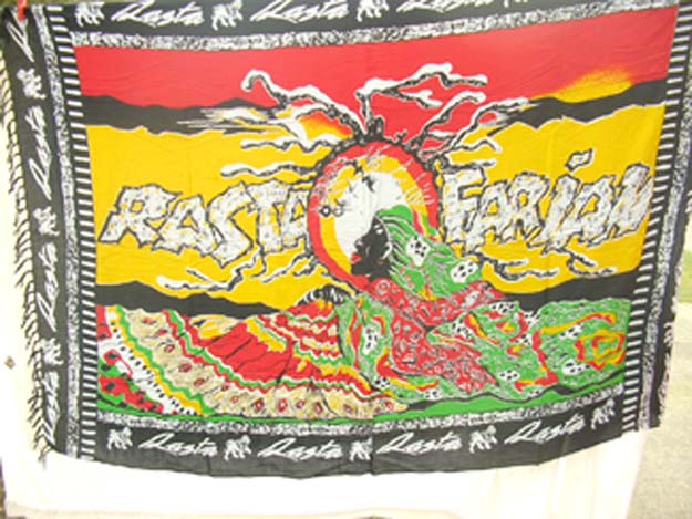 Online quality sarong supplier wholesale Tahitian Wahine Rasta farina sarong resting on the fertile earth 
