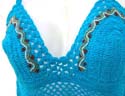 Sassy aqua crochet trim with embroidered flower on shell top, tie on neck and shoe tie in back