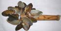Sea shell shaker with fire burn handle