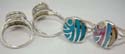 Circular assorted seashell piece and turquoise piece embedded sterlings 