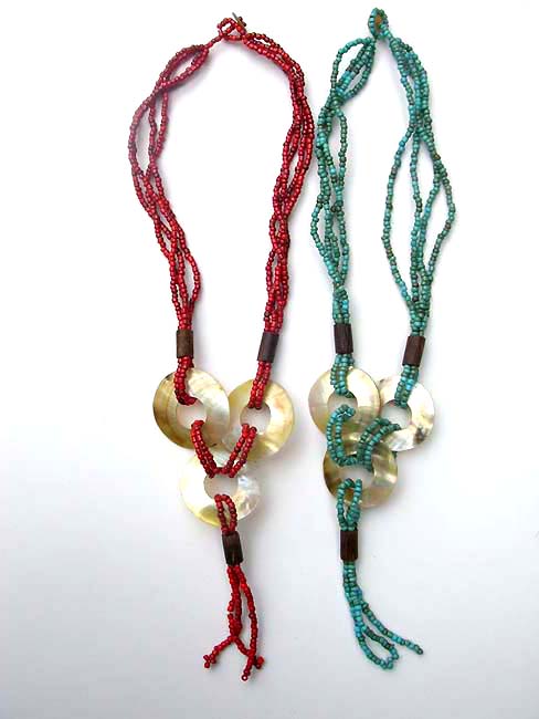 Sea shell ornament on multi string beaded necklace, international bali boutique