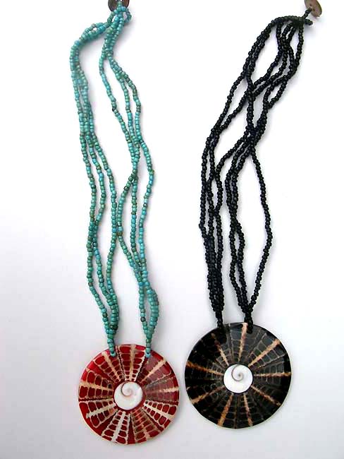 Colored sea shell pendant suspended from multi string bead necklace, fashion factory store