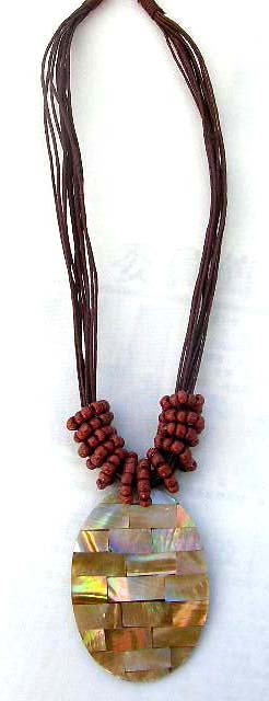 Iridescent oval pendant on necklace with twisted red beads, online gift jewelers