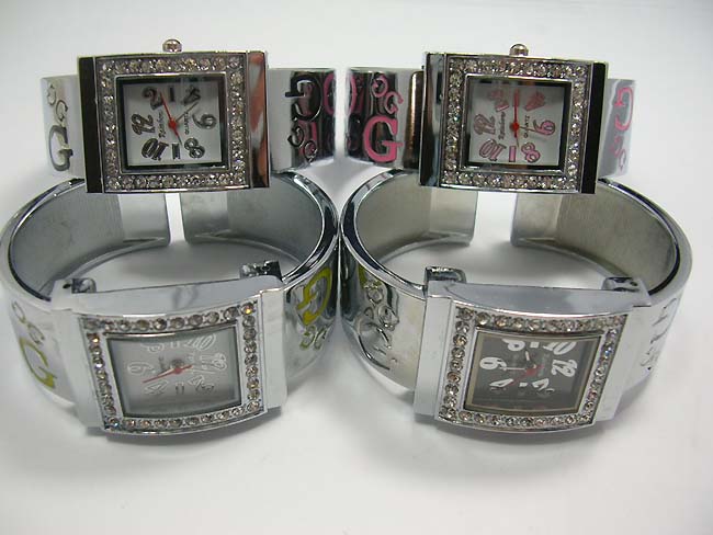 Beauty wear boutique, Flashing, gem studded frame on silver bangle watch with letters on sides