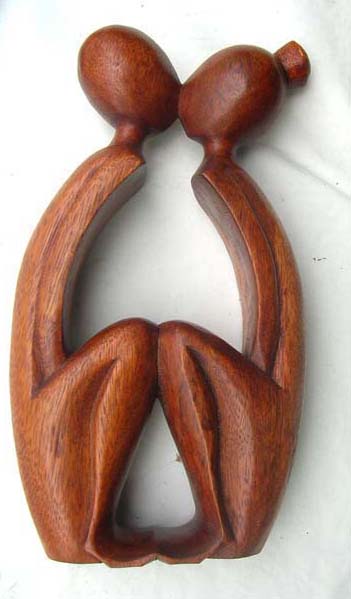 Bali art inspired statue in seated, lovers kissing motif - Trendy home furnishing decor wholesaler