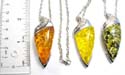 Fashion silver plated necklace with lobster clasp holding olive shape imitation amber pendant at center. Assorted color randomly pick