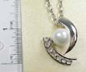 Fashion necklace with silver plated extension chain and lobster clasp, holding an imitation pearl pendant paired with multi mini clear cz on side