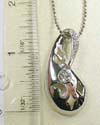 Fashion silver plated necklace holding a pearl-shaped pendant with 1 rounded cz at center and mini clear cz stone embedded on top. Lobster clasp