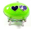 Enamel jewelry box motif an egg shape with blue double heart pattern in green color