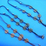 wholesale hematite necklaces. Unique bali designer coconut beads on lariat style necklace with mini beads at center.