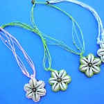 wholesale imitation amber necklaces. Starfish designed shell pendant on bali bali beaded necklace.
