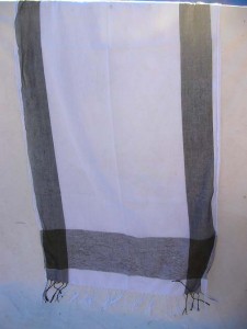 wholesale shawl wrap. One color only, white background with black on four edges.