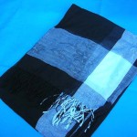 wholesale shawl. One color only, black background with white and grey on four edges.