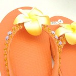 flip flop suppliers.assorted colors rubber sandal with foam plumeria flower, beads, and sequins.