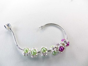 Alloy metal bead with green and pink faux pearl