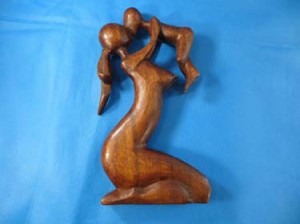 medium size mom holding baby abstract woodcarving 