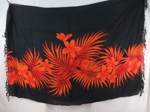 orange plumier flower leaf on black sarong