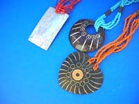 Wooden pendant necklace with engraved pattern