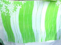 green white sarong with florals on two corners