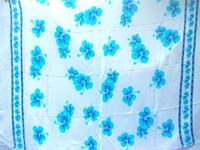 blue hibiscus flowers on white sarong