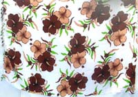 brown hibiscus on white sarong