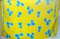 yellow Bali java stamped sarong with blue plumeria flowers